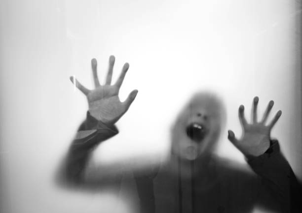 istock A boy trapping behind frosted glass 1141225021