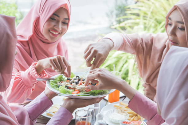 istock Young muslim woman having lunch 1141225959