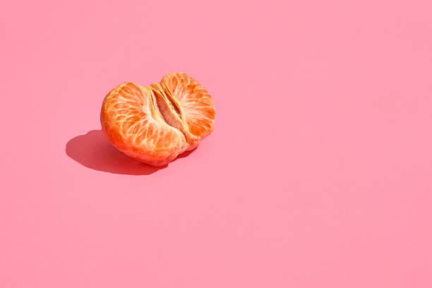 istock Half of grapefruit citrus fruit isolated on pink 1141226185