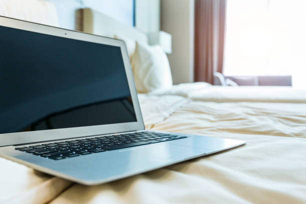 istock Laptop on bed in hotel room 1141226537