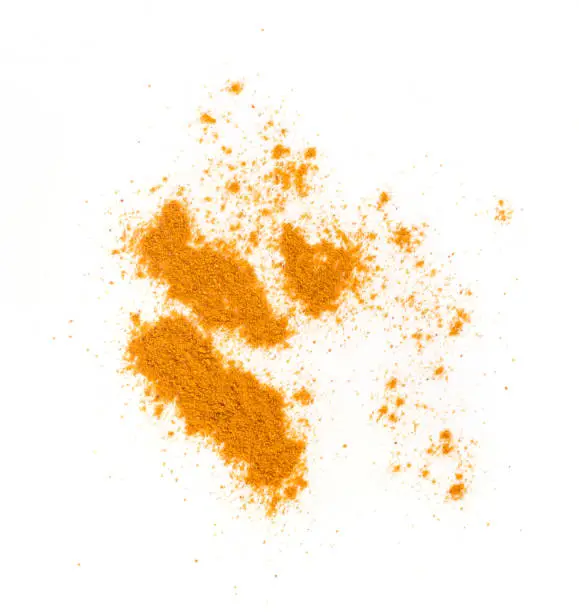 Mixture of Indian Spices and Herbs Powders with Cumin, Curry, Curcuma, Turmeric and Chilli Pepper. Orange Seasoning Powder Mix Isolated on White Background Top View