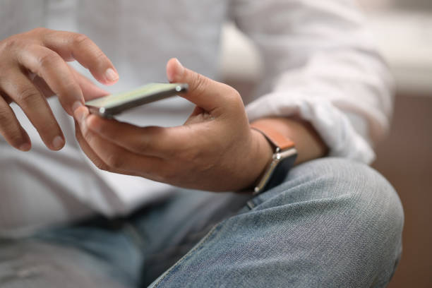 istock Close up of man using mobile smartphone 1141229475