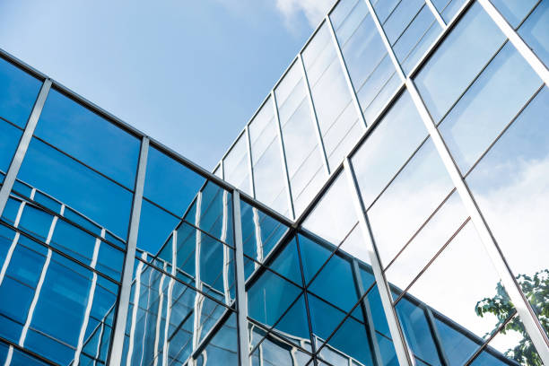 istock Office building wall reflecting the blue sky 1141230379