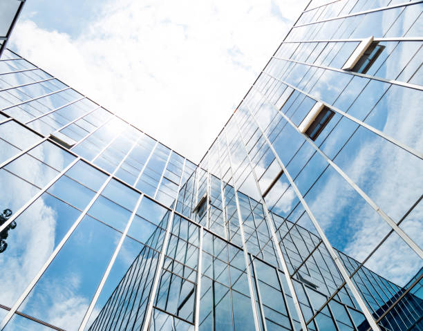 istock Office building wall reflecting the cloud sky 1141230512