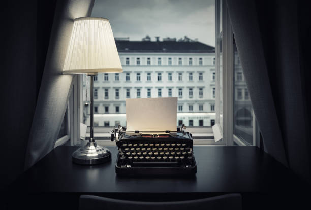 istock Workplace of a writer, journalist, creator. An old typewriter and a lamp on the table. Retro style. The concept on scientific, historical, literature, education and philosophical topics. 1141230578