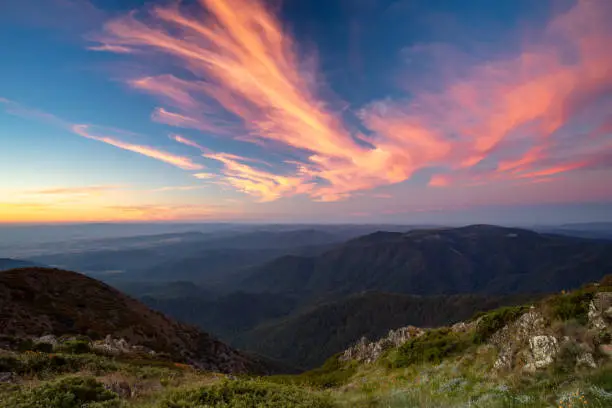 The view at sunset from the summit of Mt Buller over the Victorian Alps in the Victorian High Country, Australia