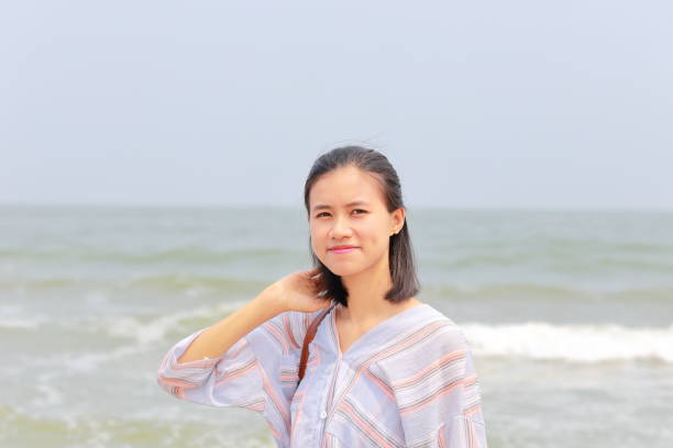 istock young woman at Samson beach in Vietnam 1141232723