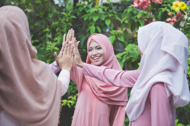 istock Happy friend putting hands together 1141233689