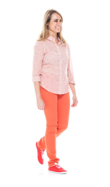 istock Beautiful white female in bright clothes - walking 1141234332