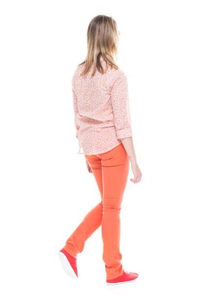 istock Beautiful white female in bright clothes - walking 1141234333