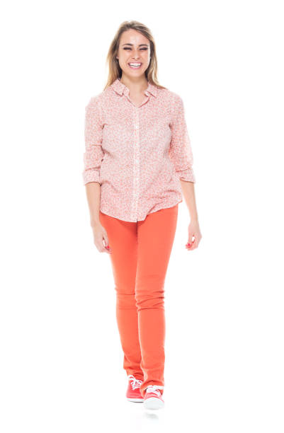 istock Beautiful white female in bright clothes - walking 1141234340