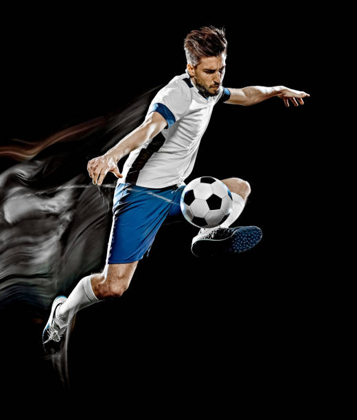 caucasian soccer player man isolated black background light painting