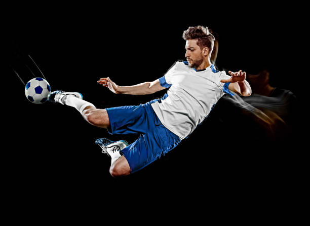 istock caucasian soccer player man isolated black background light painting 1141237721