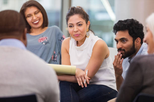 istock Attentive therapist listens to man during support group meeting 1141239212