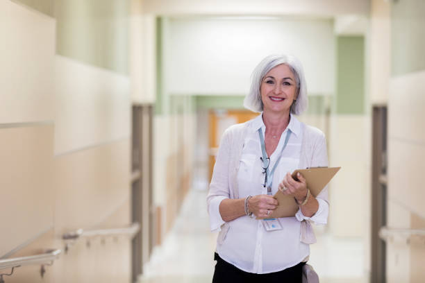 istock The school principal stops for a yearbook photo 1141239336