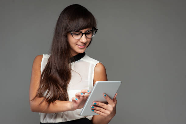 istock Beautiful female high school student studying with books 1141239375