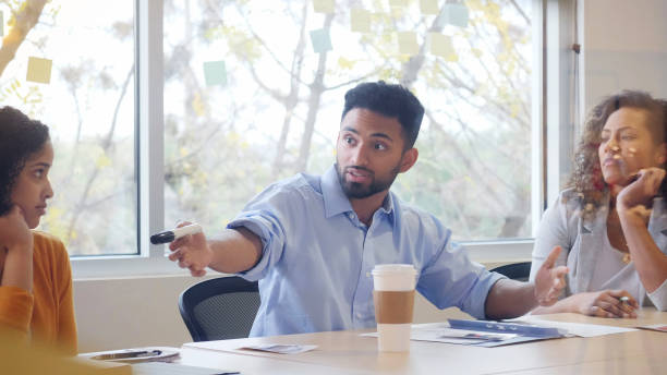 istock Serious young businessmen discusses an issue during meeting 1141239398