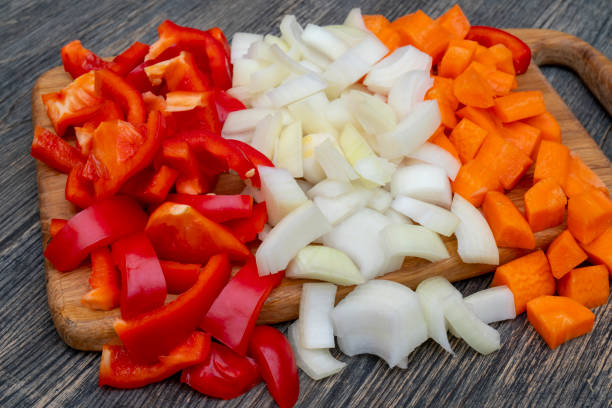 istock Cut onions, carrots, sweet Bulgarian pepper. 1141240553