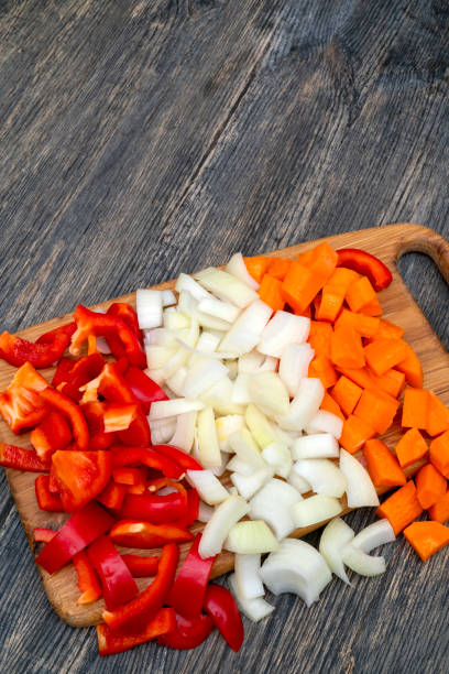 istock Cut onions, carrots, sweet Bulgarian pepper. 1141240564