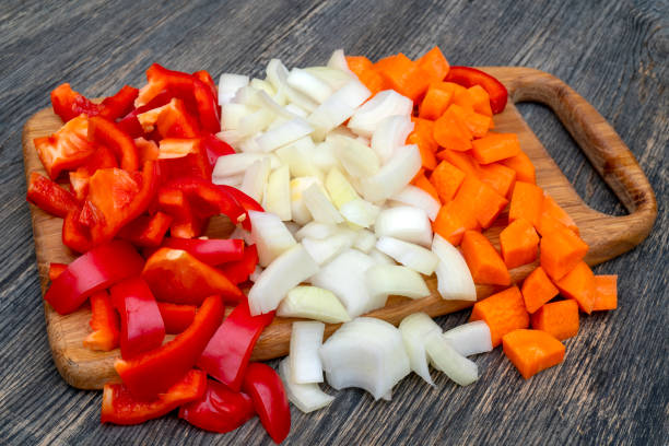 istock Cut onions, carrots, sweet Bulgarian pepper. 1141240641