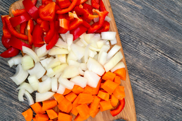 istock Cut onions, carrots, sweet Bulgarian pepper. 1141240654