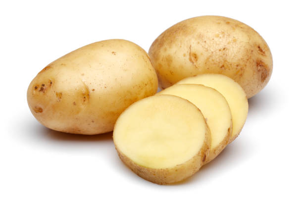 istock Fresh potatoes with slices isolated on white 1141240658