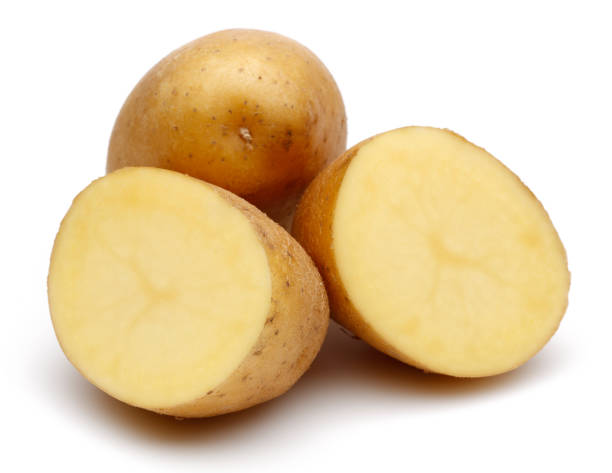 istock Fresh potatoes with slices isolated on white 1141240716