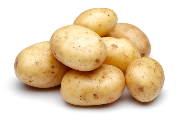 istock Heap of fresh potatoes isolated on white 1141240719