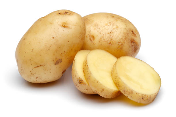 istock Fresh potatoes with slices isolated on white 1141240750