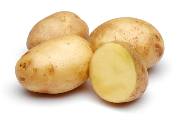 istock Fresh potatoes with slices isolated on white 1141240810