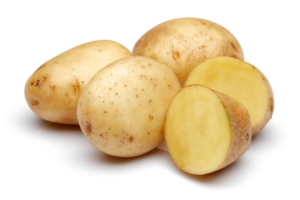 istock Fresh potatoes with slices isolated on white 1141240928
