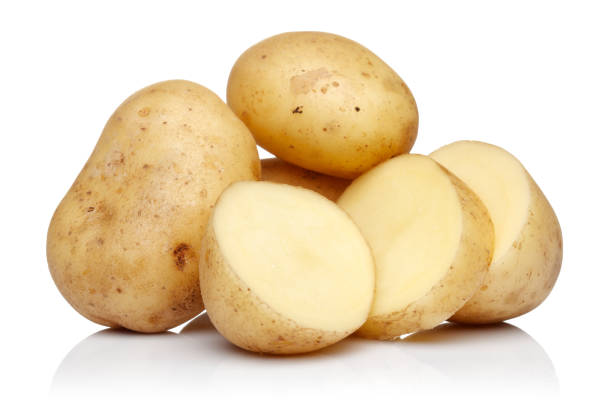 istock Fresh potatoes with slices isolated on white 1141241042