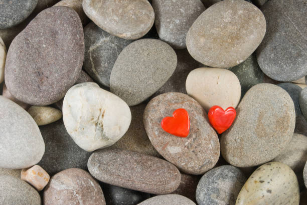 istock two red hearts on the stones 1141241379