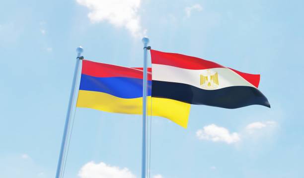 istock Egypt and Armenia, two flags waving against blue sky 1141243045