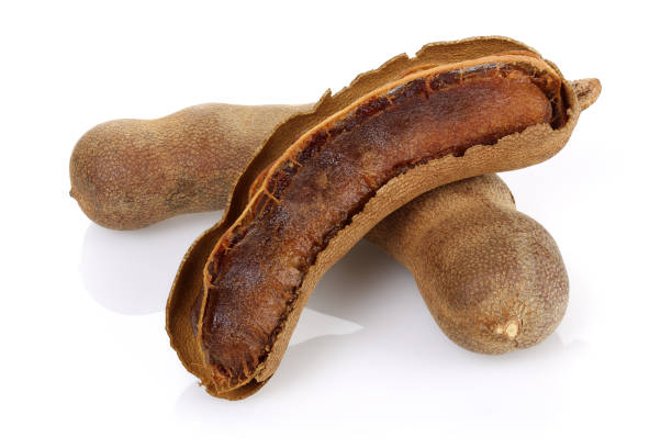 istock Fresh tamarind fruit isolated on white 1141243195