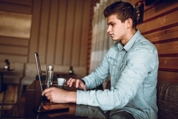 istock Handsome Male Doing Work On Laptop 1141243315