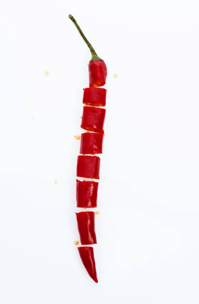 Slice red chili peppers on white background.