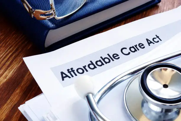 Photo of Affordable care act ACA or Obamacare and stethoscope.