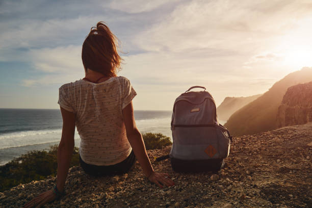 istock Tourist girl with backpack enjoying the view. 1141248146
