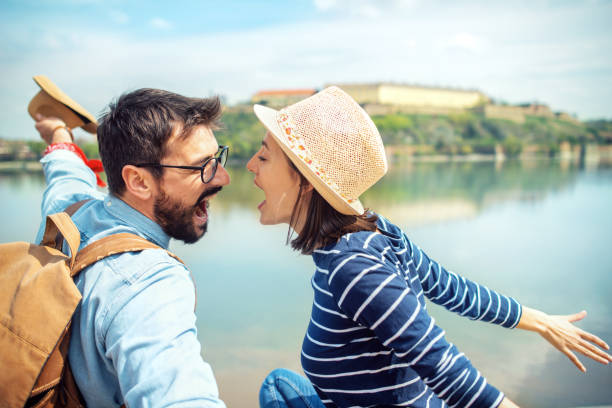 Happy young couple having fun on their travel Cheerful young couple enjoying around the city exit festival stock pictures, royalty-free photos & images