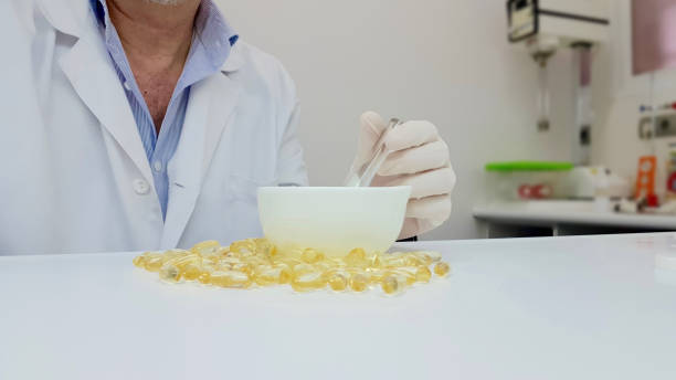 istock Pharmacist preparing gelatinous oil capsules 1141248724