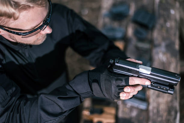 istock sports shooting instructor check your weapons close-up 1141249623