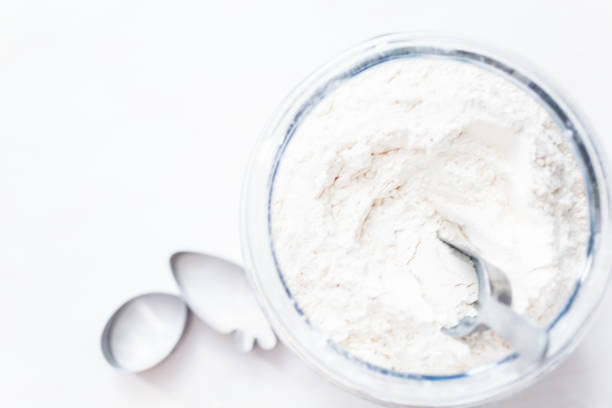 istock White flour in a large glass jar. 1141249764