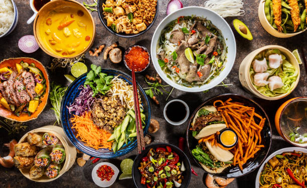 Top view composition of various Asian food in bowl Top view composition of various Asian food in bowls, free space for text restaurant table layout stock pictures, royalty-free photos & images