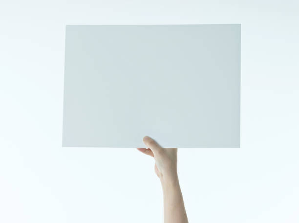 istock Woman hand holding a blank paper 1141250898