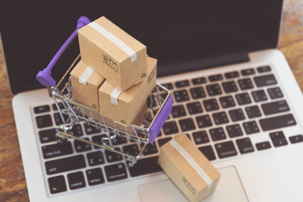 istock Online shopping or ecommmerce delivery service concept,Paper box on a laptop computer ,Easy shopping online concept 1141251432