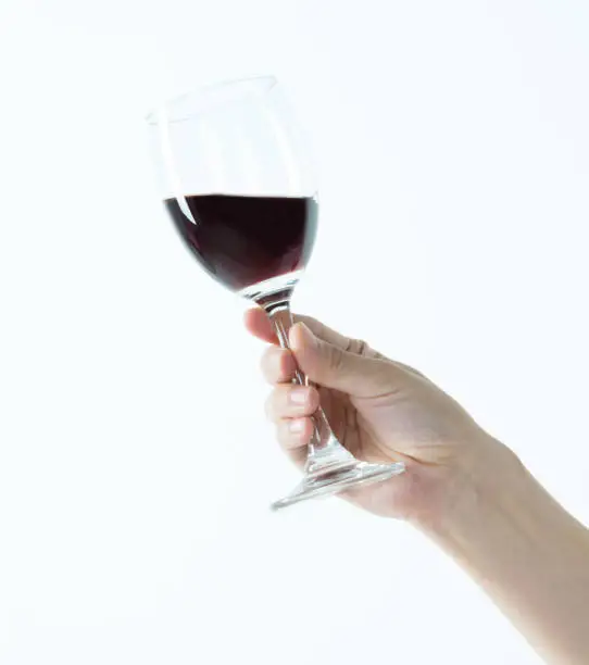 Photo of Woman hand holding a glass of wine