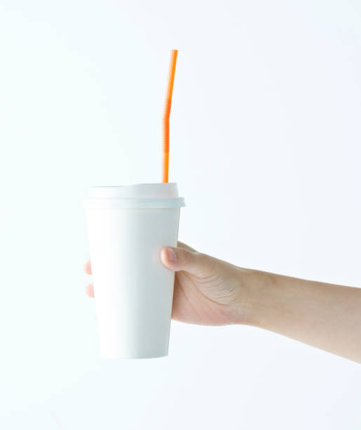 istock Woman hand holding a white disposable cup 1141251736