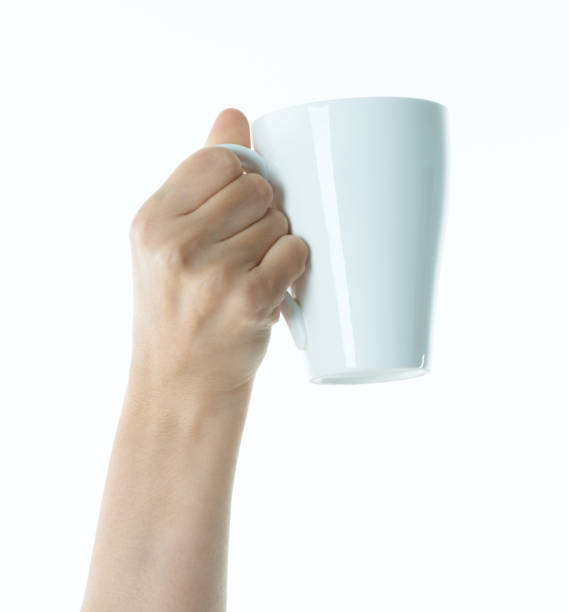 istock Woman hand holding a white mug 1141251737