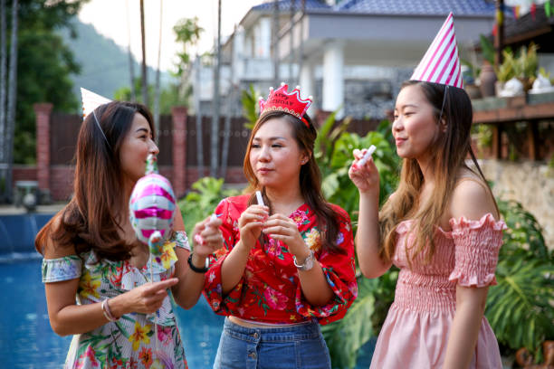 istock Friends celebrating birthday party at pool 1141253076